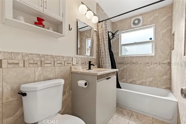 a bathroom with a sink a toilet and a bathtub