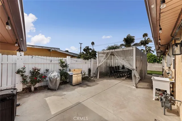 a group of people sitting in patio of a building