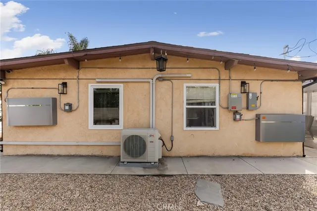 a front view of a house with sitting area