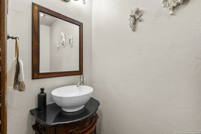 a bathroom with a sink and a mirror