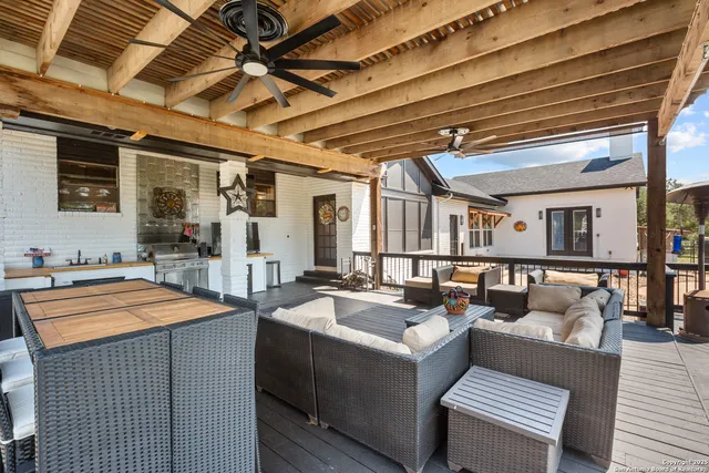 a outdoor space with a couch and wooden floor