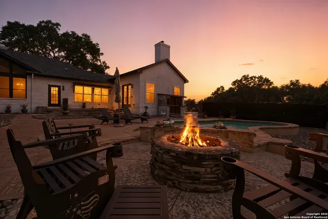 a view of a chairs and table in the patio