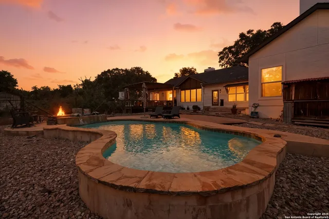 a view of a swimming pool with a lounge chairs