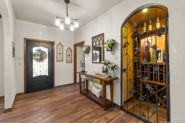 a view of an entryway with wooden floor