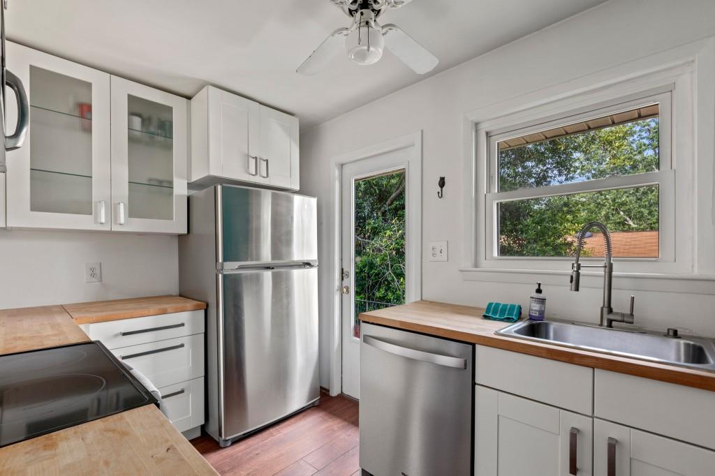 a kitchen with a refrigerator and a sink