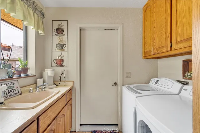 a spacious bathroom with a granite countertop sink a mirror and shower