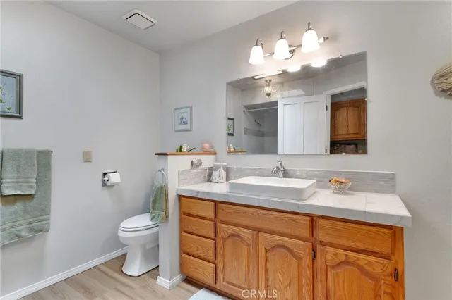 a living room with furniture a chandelier and a dining room