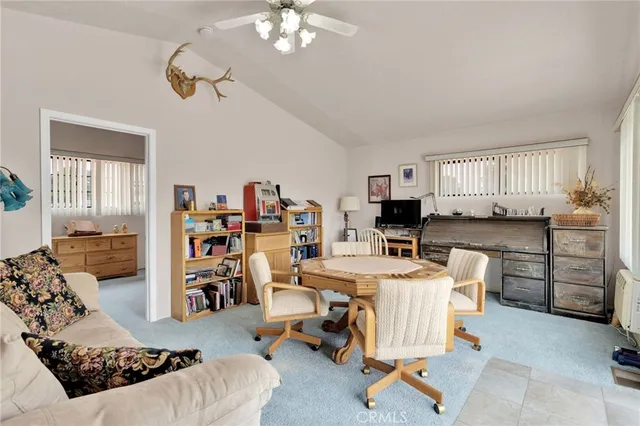 a balcony with table and chairs