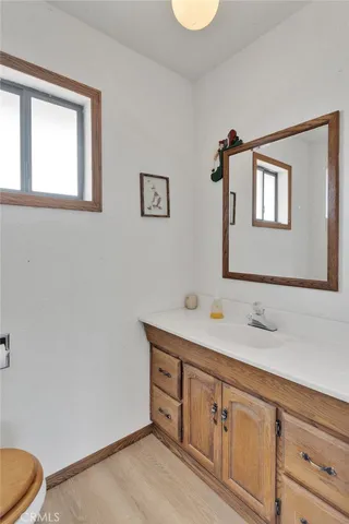 a front view of a house with swimming pool having outdoor seating