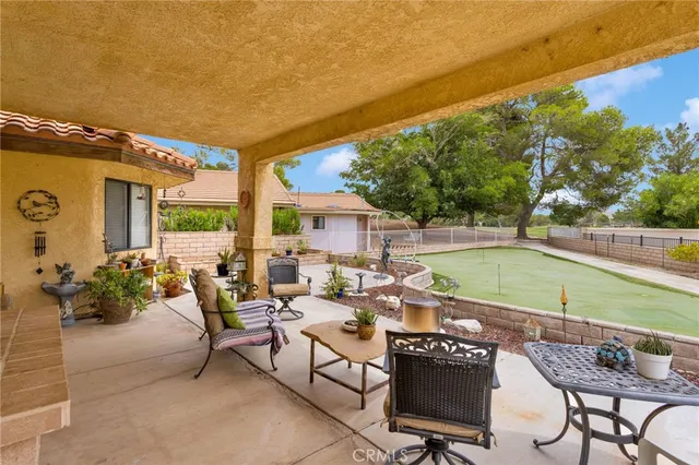 a view of a brick wall with two windows