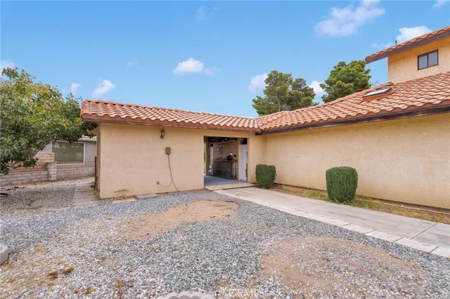 an aerial view of residential houses with outdoor space and city view