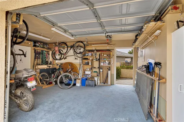 an aerial view of a house with swimming pool and porch