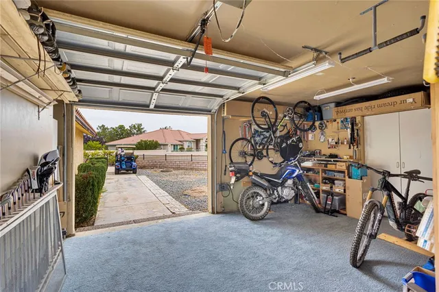 an aerial view of a city with lots of residential buildings and ocean view in back