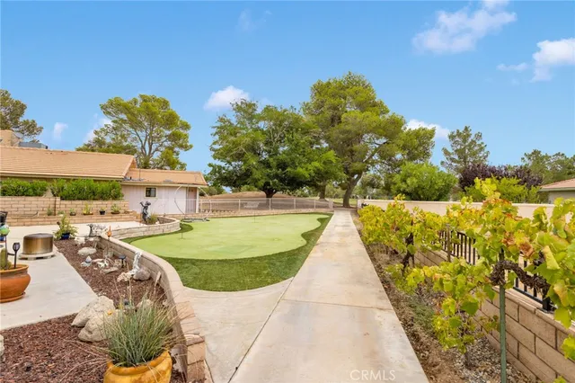 an aerial view of residential houses with outdoor space and river