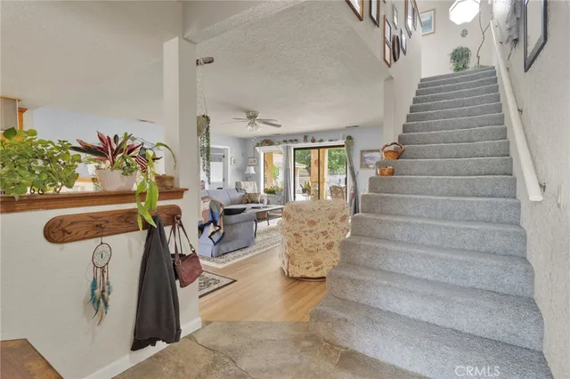 a living room with furniture flat screen tv and a fireplace