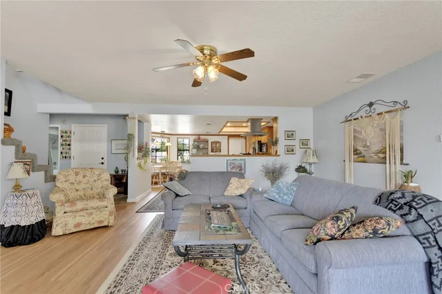a very nice looking living room with dining room and furniture