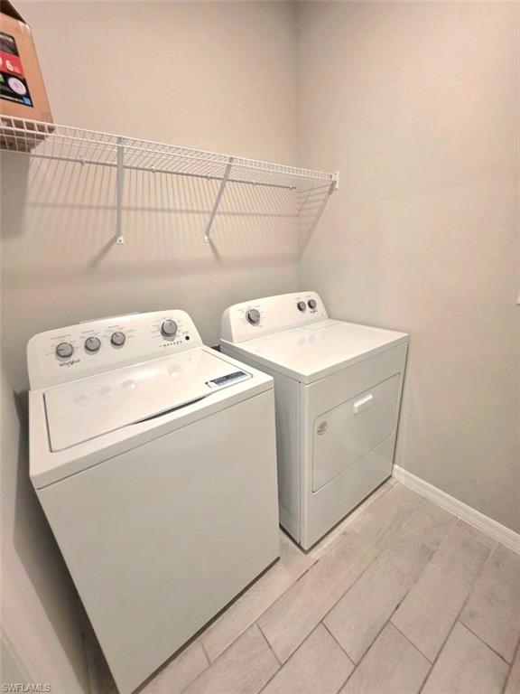 3811 21st Street Southwest Lehigh Acres, FL 33976 - Photo 6 of 8 a utility room with dryer and washer
