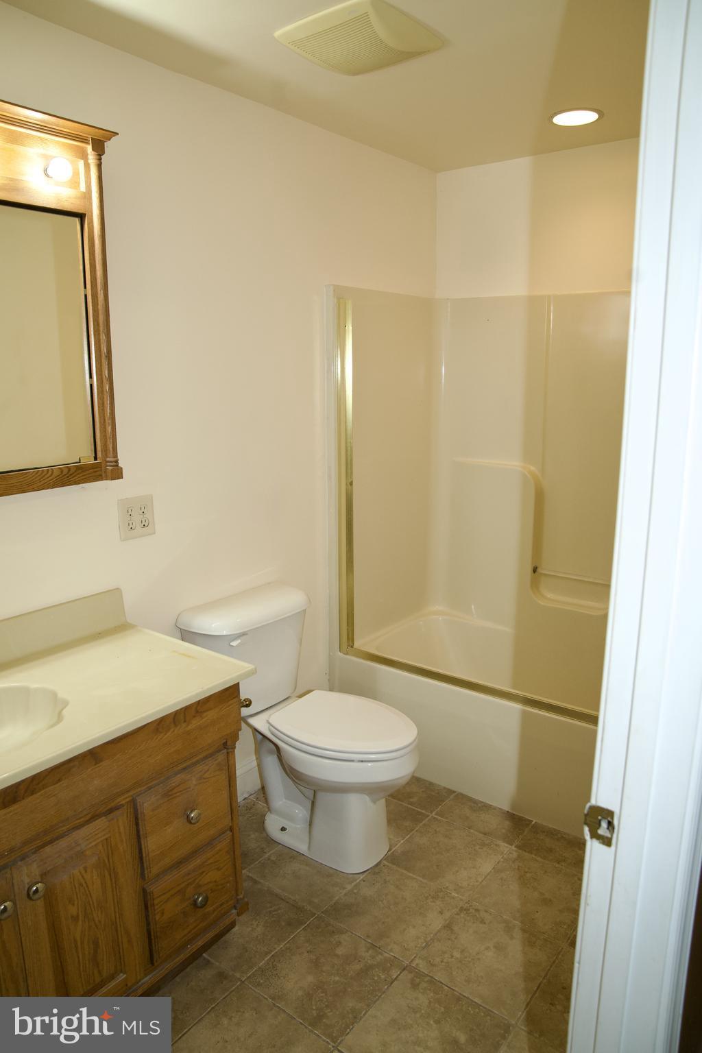 31867 Shavox Road Salisbury, MD 21804 - Photo 55 of 64 a bathroom with a sink a toilet and shower