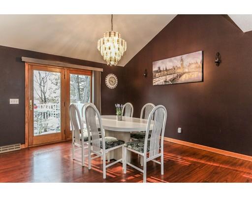 88 Intervale Road Springfield, MA 01118 - Photo 5 of 14 a view of a dining room with furniture wooden floor and chandelier