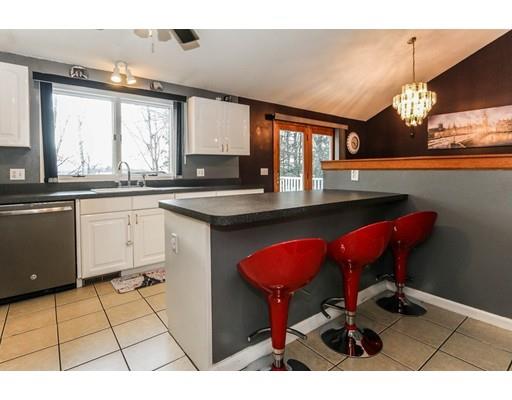 88 Intervale Road Springfield, MA 01118 - Photo 8 of 14 a kitchen with a sink a stove cabinets and dining table