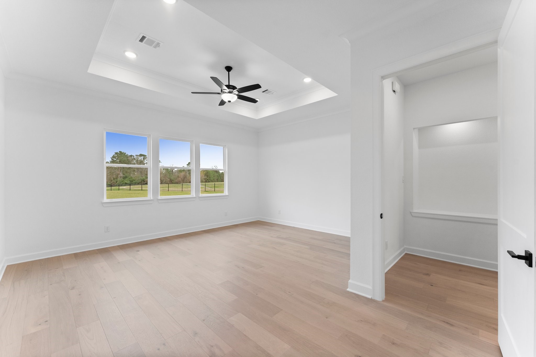 7315 Julie Pond Lane Spring, TX 77389 - Photo 23 of 48 wooden floor in an empty room with a window