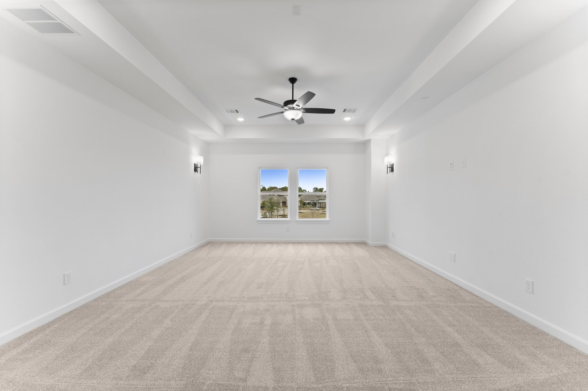 7315 Julie Pond Lane Spring, TX 77389 - Photo 38 of 48 an empty room with chandelier fan and windows