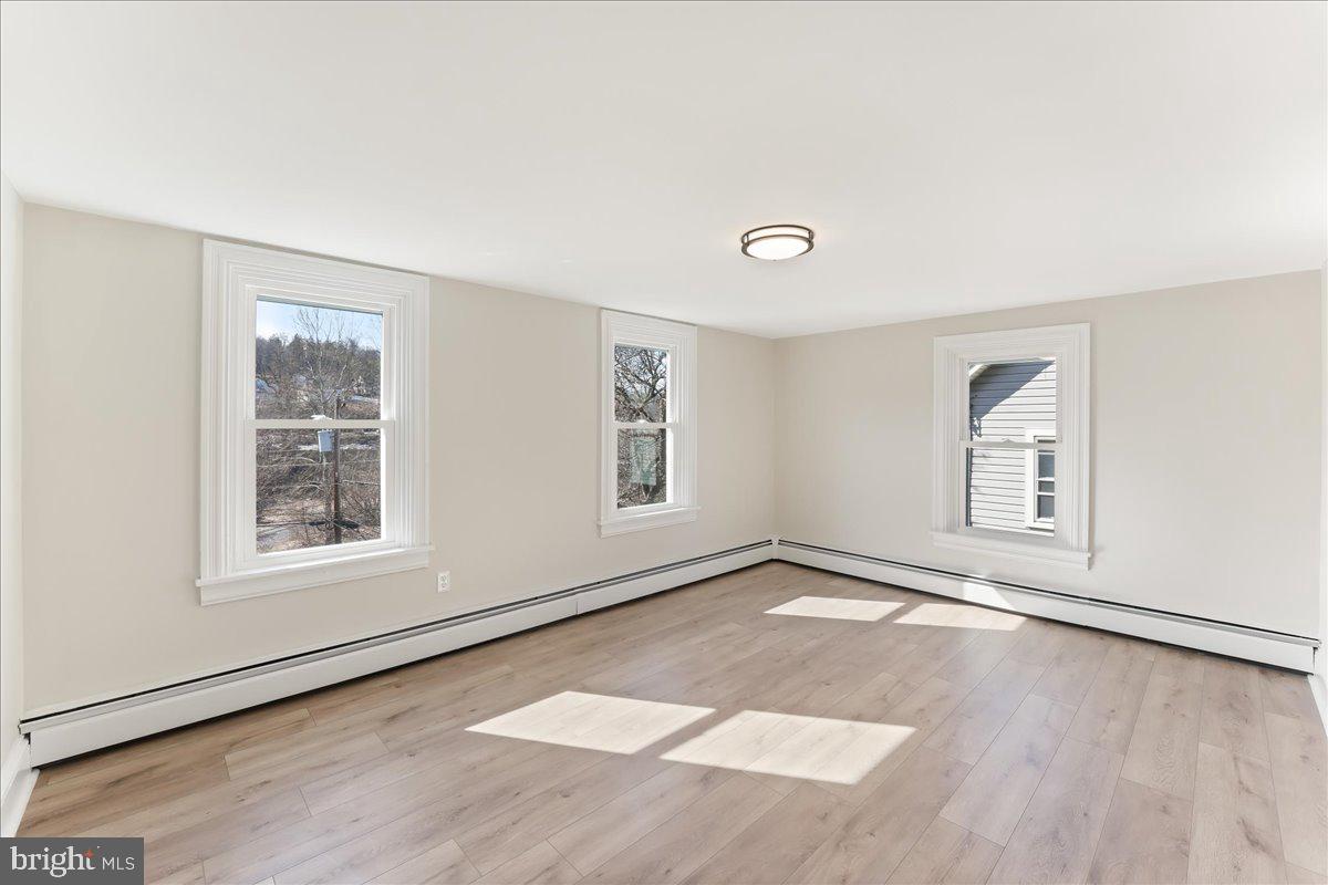 8 Convent Road Aston, PA 19014 - Photo 17 of 28 an empty room with wooden floor and windows