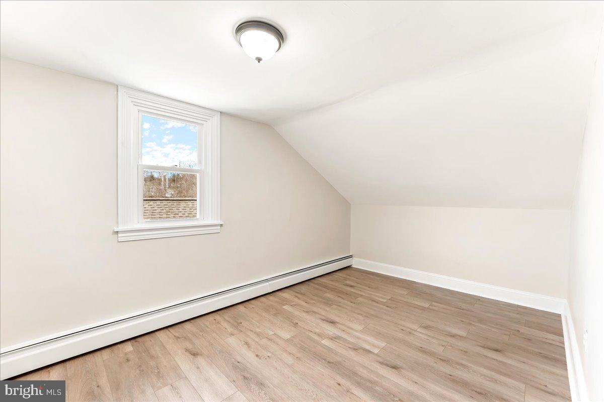 8 Convent Road Aston, PA 19014 - Photo 22 of 28 an empty room with wooden floor and windows