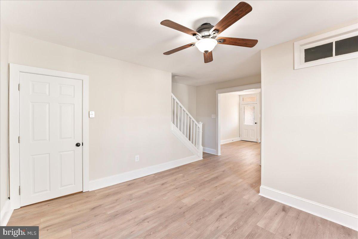 8 Convent Road Aston, PA 19014 - Photo 9 of 28 an empty room with wooden floor and windows
