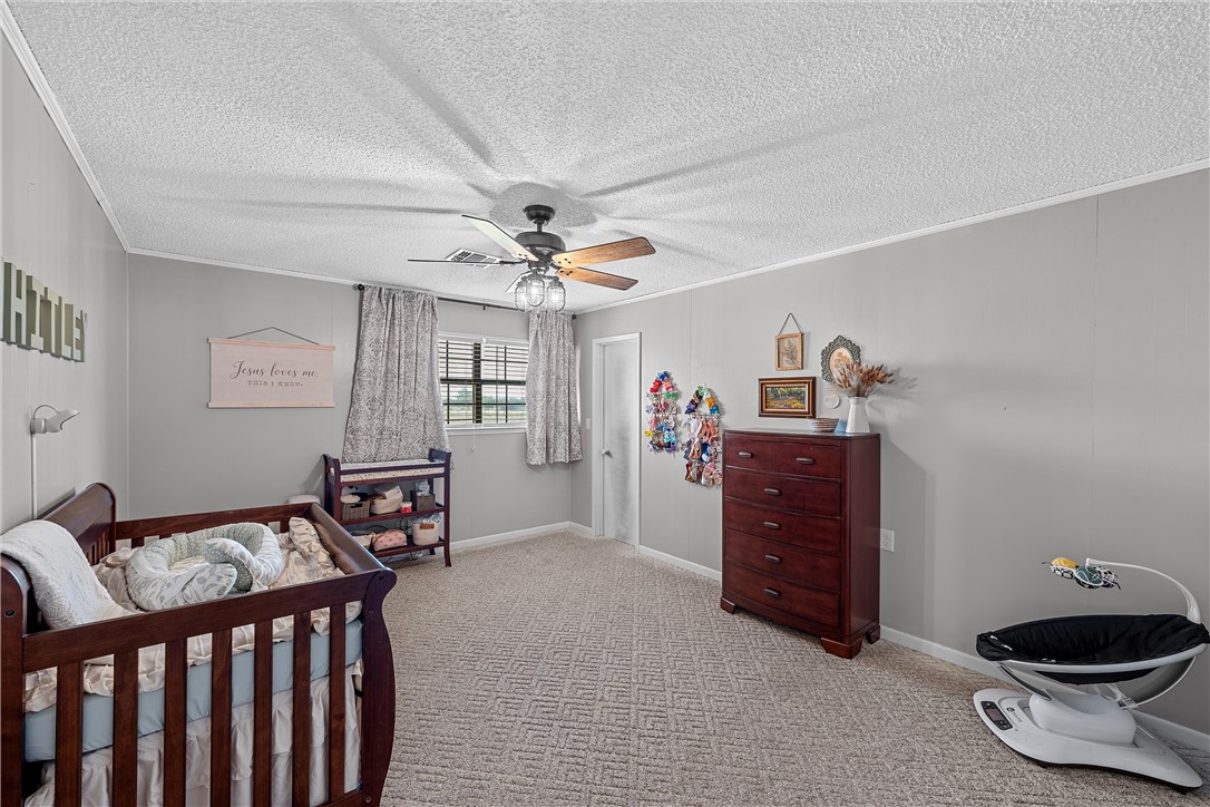 126 Cr 173 Road Marlin, TX 76661 - Photo 17 of 48 a room with furniture and chandelier