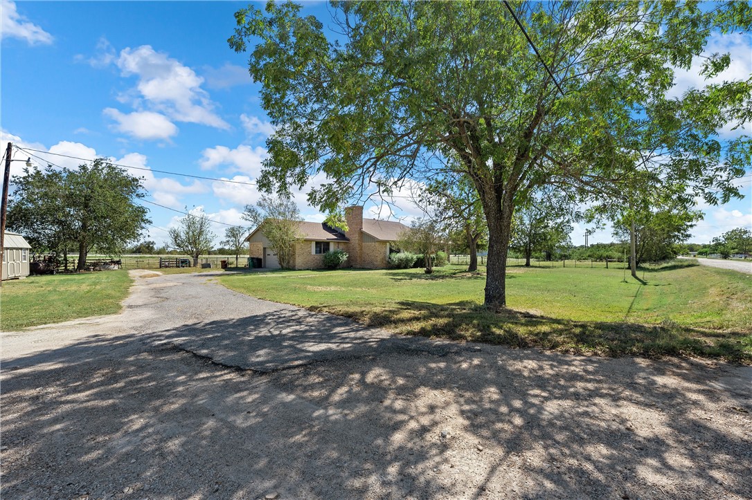 126 Cr 173 Road Marlin, TX 76661 - Photo 2 of 48 a view of a garden with a house