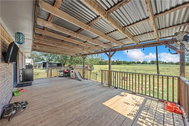 a view of outdoor space with wooden floor and iron stairs