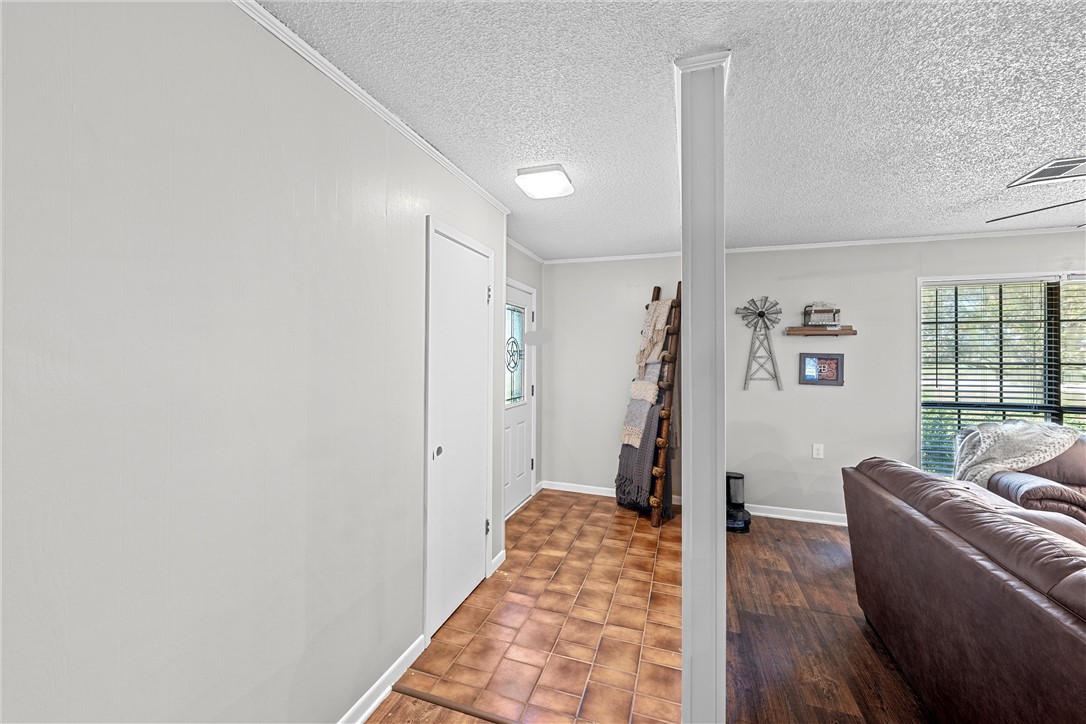 126 Cr 173 Road Marlin, TX 76661 - Photo 4 of 48 a living room with furniture and a wooden floor