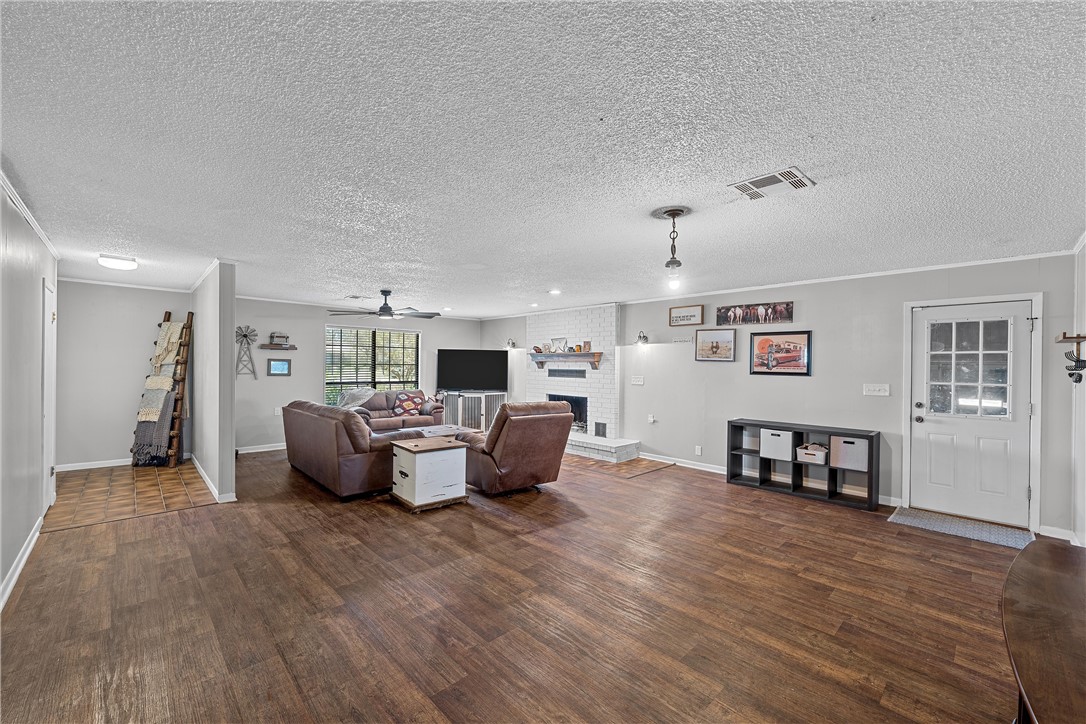 126 Cr 173 Road Marlin, TX 76661 - Photo 5 of 48 a living room with furniture and a wooden floor