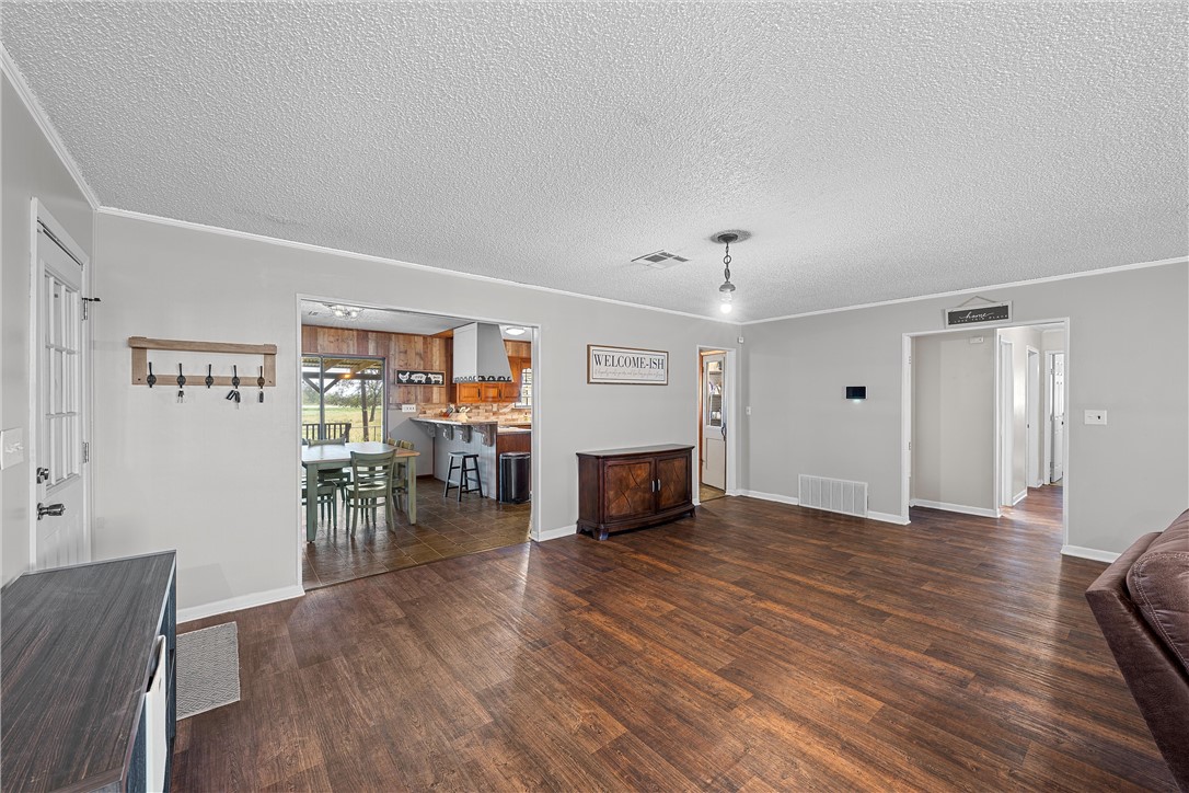 126 Cr 173 Road Marlin, TX 76661 - Photo 8 of 48 a view of a livingroom with furniture and wooden floor