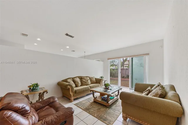 a living room with furniture and a couch