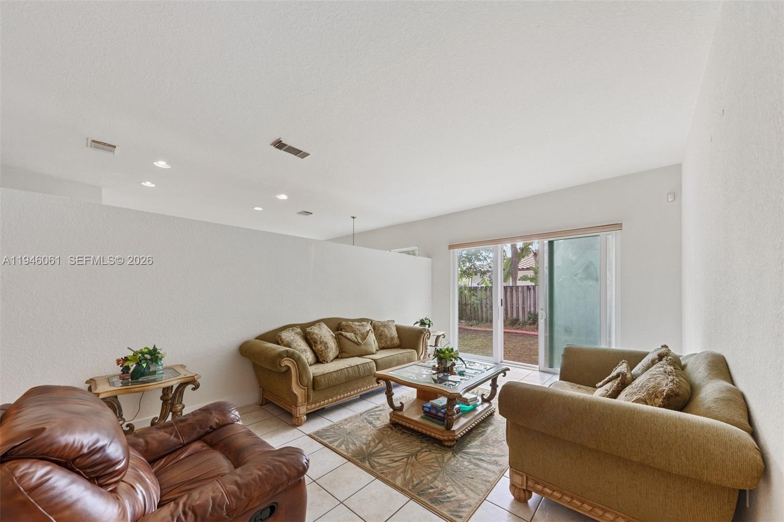 15932 Southwest 146th Terrace Miami, FL 33196 - Photo 11 of 25 a living room with furniture and a couch