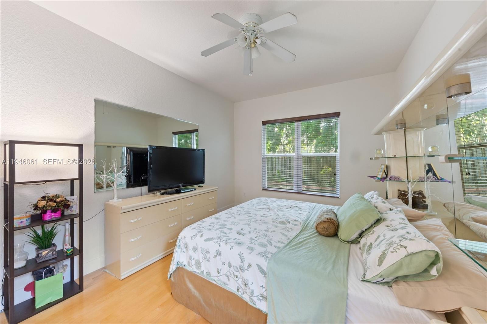 15932 Southwest 146th Terrace Miami, FL 33196 - Photo 13 of 25 a bedroom with a bed and a flat screen tv