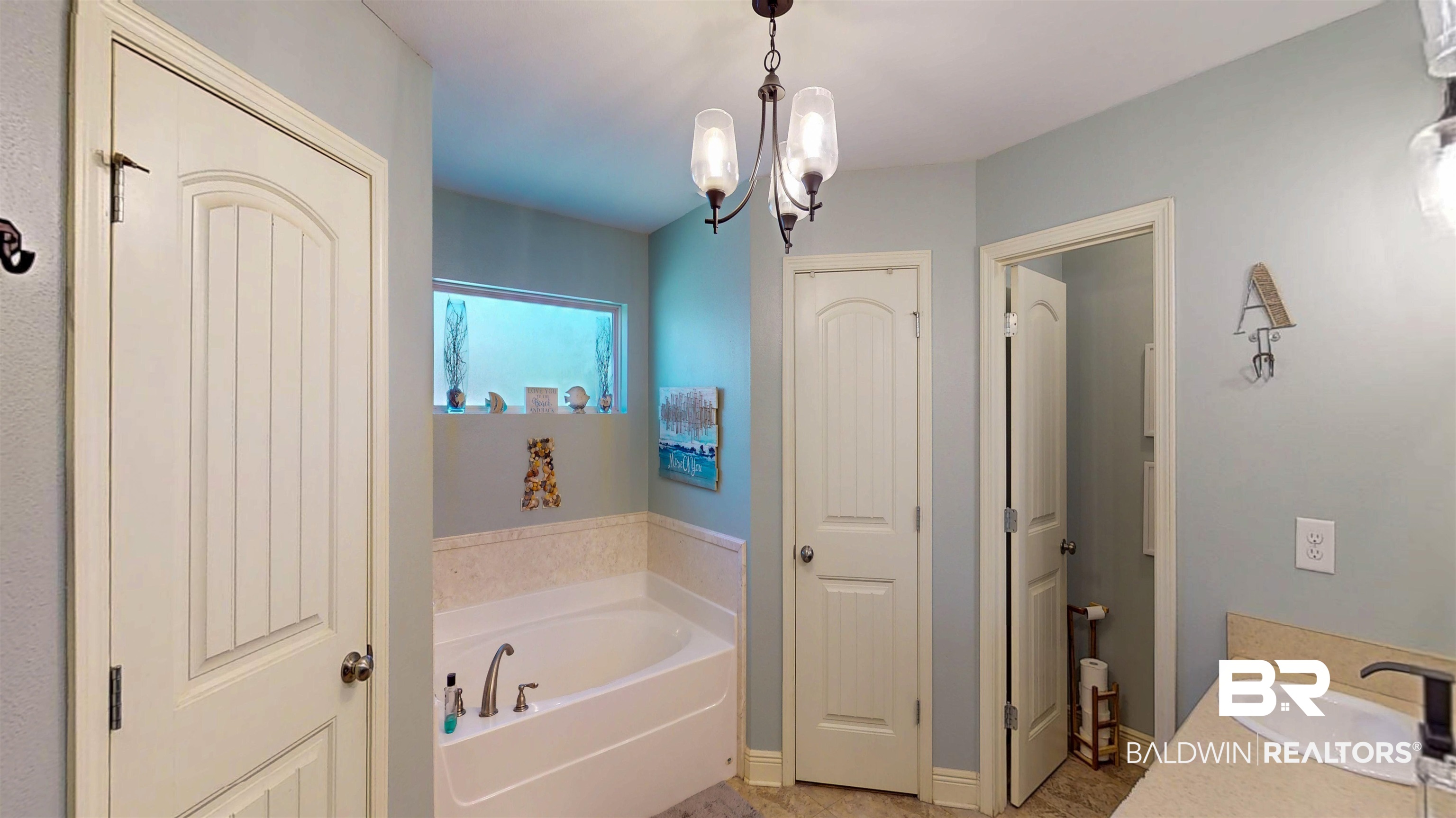 1304 Majesty Loop Foley, AL 36535 - Photo 14 of 44 Full bathroom with a garden tub, vanity, hanging lights, and a closet