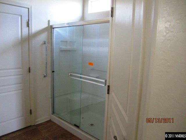1226 Firefly Court Reno, NV 89523 - Photo 8 of 13 a bathroom with a glass shower door