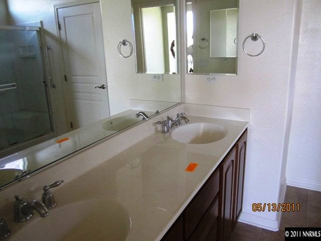 1226 Firefly Court Reno, NV 89523 - Photo 10 of 13 a bathroom with a sink and mirror