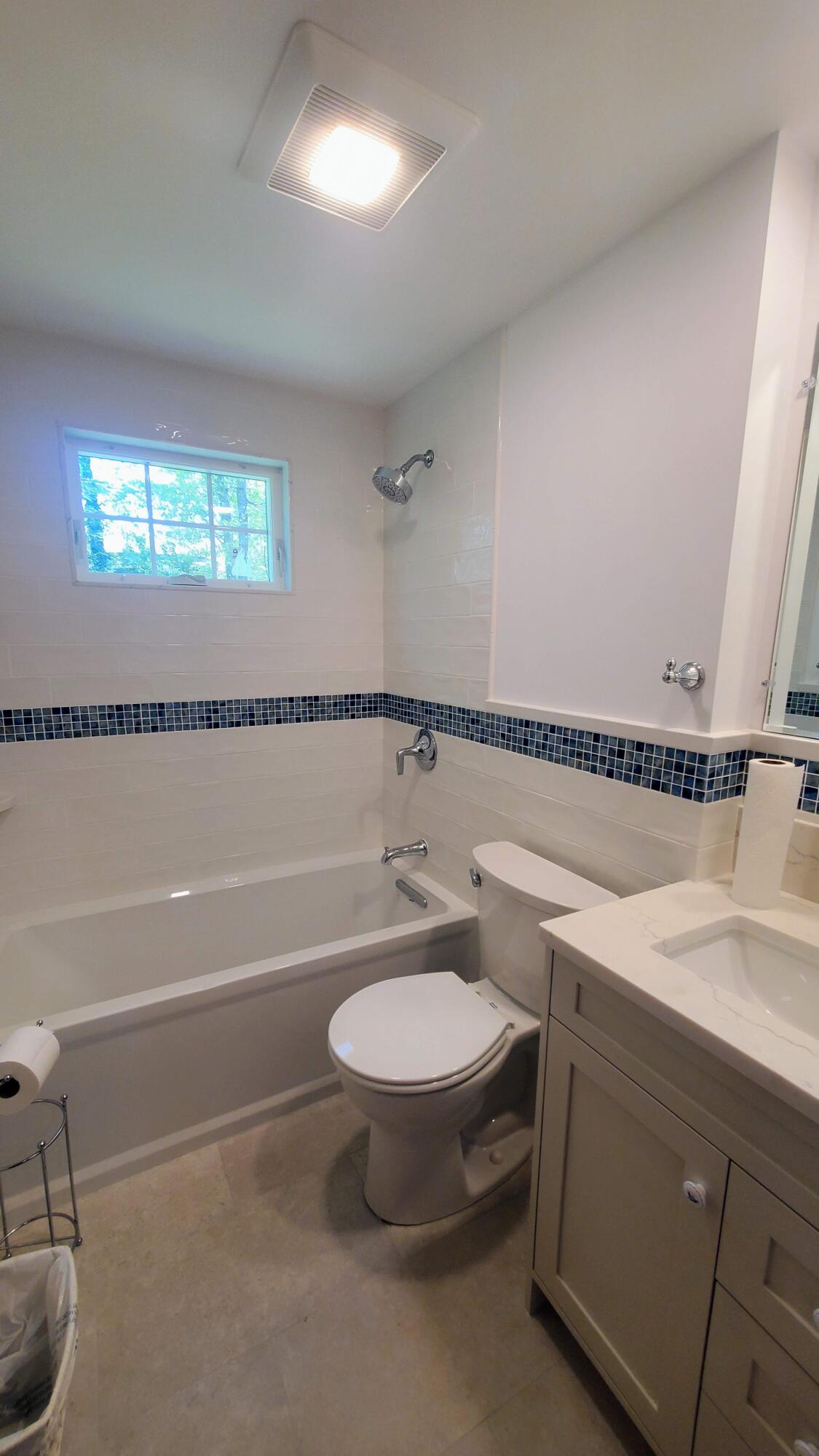 66 Uncle Edwards Road Mashpee, MA 02649 - Photo 17 of 18 a bathroom with a sink a toilet and a bathtub