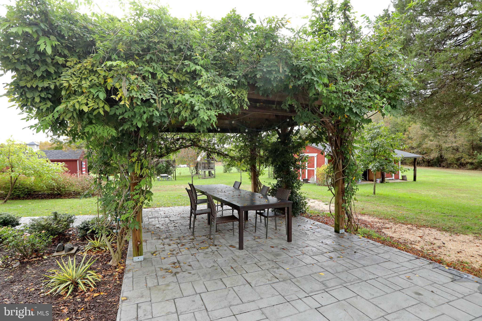 5065 Bicknell Road Marbury, MD 20658 - Photo 74 of 105 Wysteria covered patio & pergola
