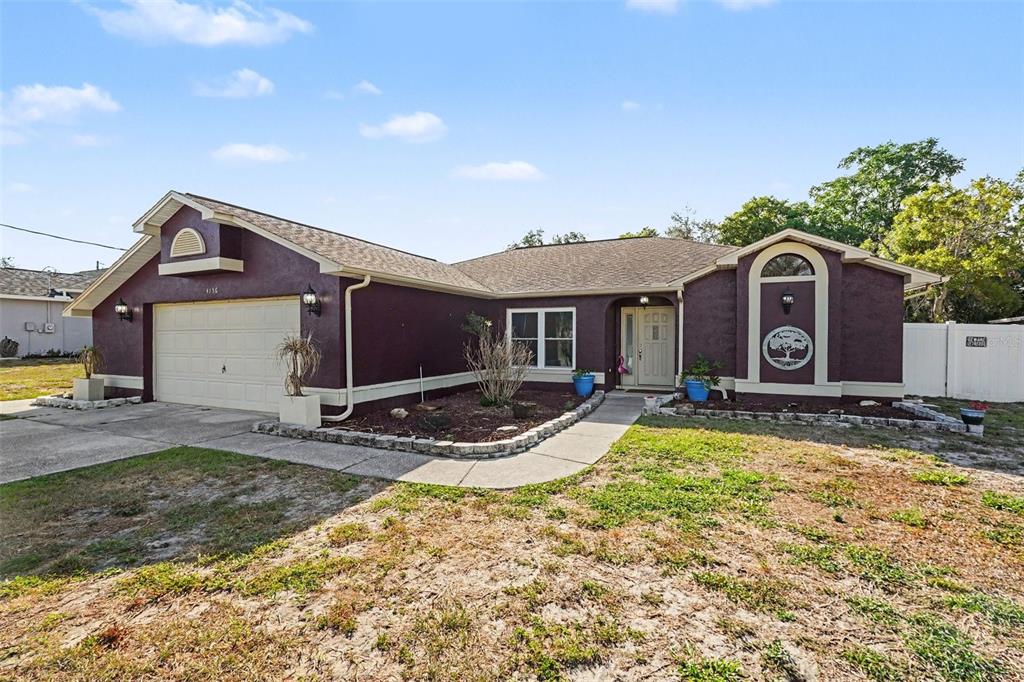 4156 Weldon Avenue Spring Hill, FL 34609 - Photo 1 of 26 a view of a house with backyard and sitting area