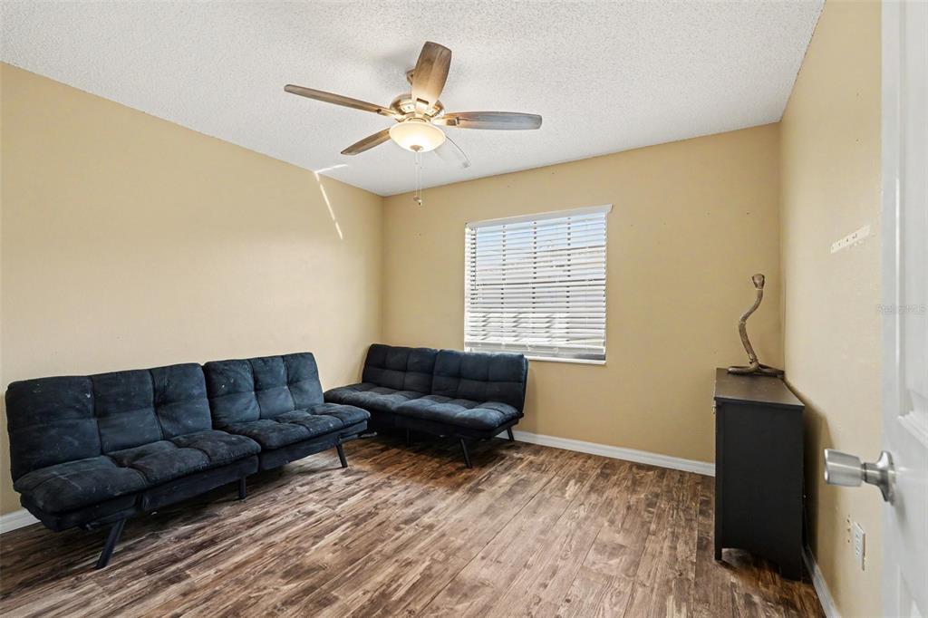 4156 Weldon Avenue Spring Hill, FL 34609 - Photo 18 of 26 a living room with furniture and a window
