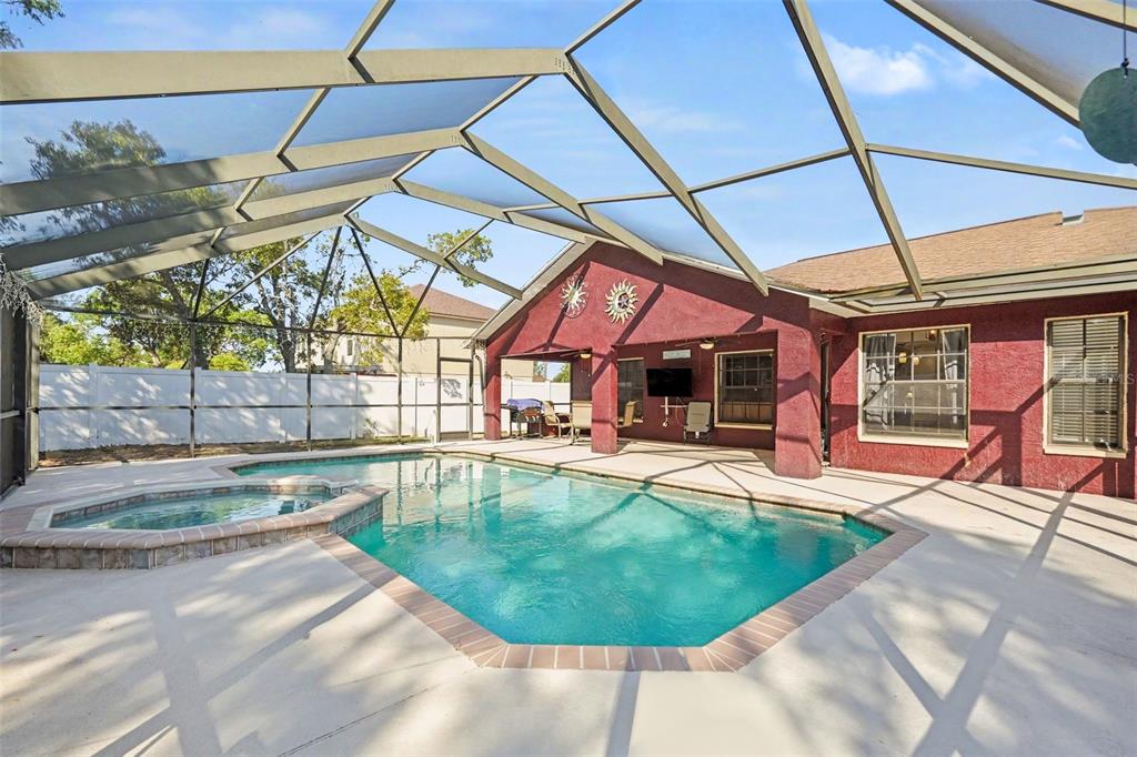 4156 Weldon Avenue Spring Hill, FL 34609 - Photo 2 of 26 a view of a backyard with a swimming pool