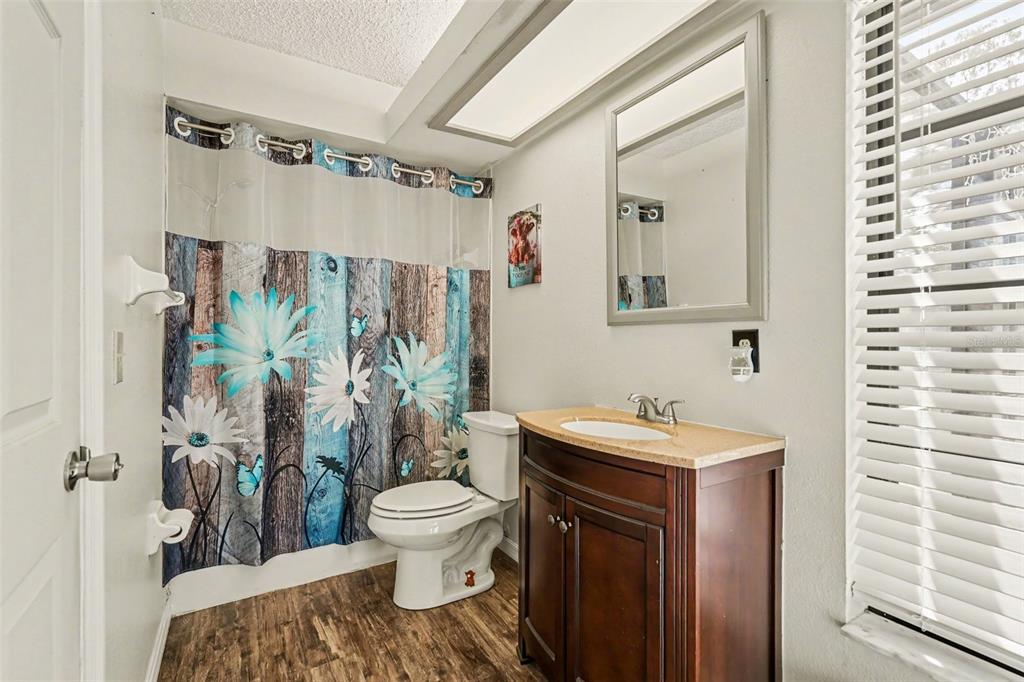 4156 Weldon Avenue Spring Hill, FL 34609 - Photo 22 of 26 a bathroom with a sink toilet and shower