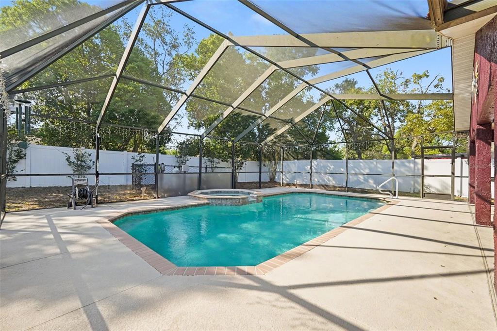 4156 Weldon Avenue Spring Hill, FL 34609 - Photo 24 of 26 a view of a backyard with a swimming pool