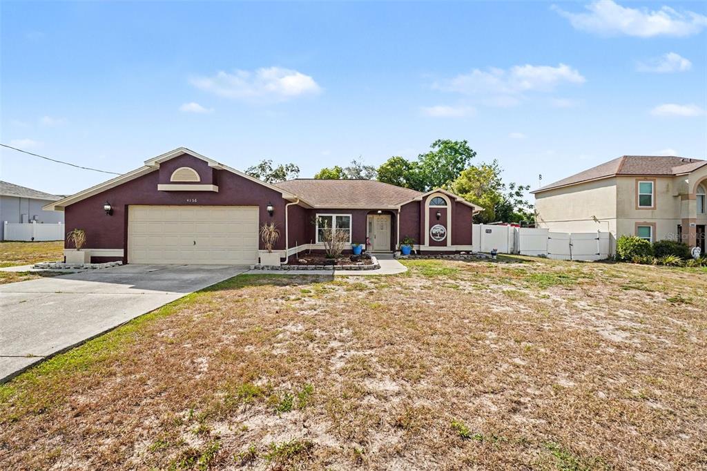 4156 Weldon Avenue Spring Hill, FL 34609 - Photo 6 of 26 a front view of a house with a yard