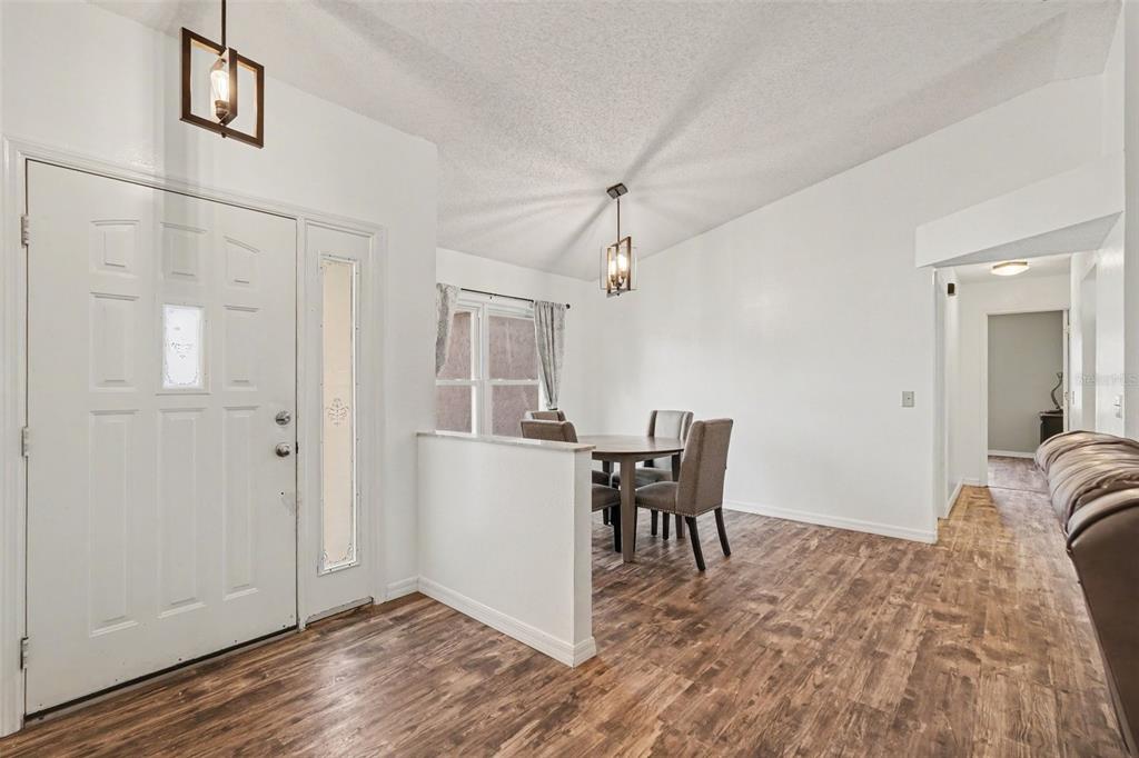 4156 Weldon Avenue Spring Hill, FL 34609 - Photo 7 of 26 a view of a livingroom with furniture and wooden floor